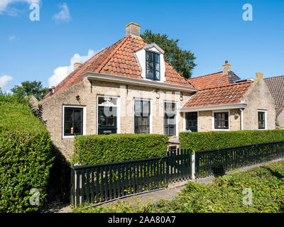 Facades of historic houses in Langestreek street on West Frisian island Schiermonnikoog, Netherlands Stock Photo