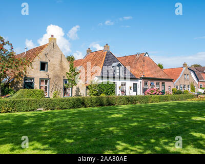 Facades of historic houses in Langestreek street on West Frisian island Schiermonnikoog, Netherlands Stock Photo