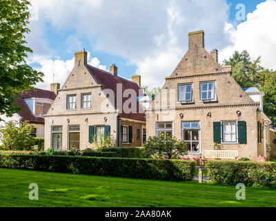 Facades of historic houses in Langestreek street on West Frisian island Schiermonnikoog, Netherlands Stock Photo