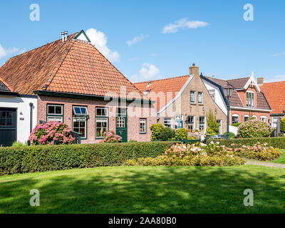 Facades of historic houses in Langestreek street on West Frisian island Schiermonnikoog, Netherlands Stock Photo