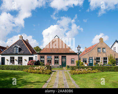 Facades of historic houses in Langestreek street on West Frisian island Schiermonnikoog, Netherlands Stock Photo