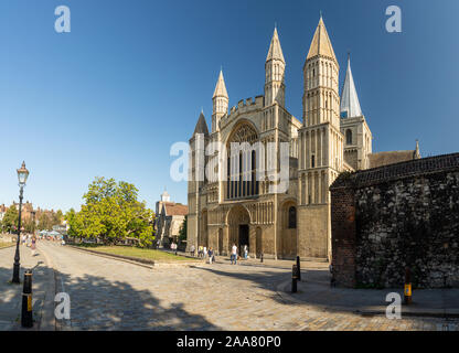 Rochester, England, UK - September 21, 2019: Tourists walk past the Romanesque cathedral of Rochester in Kent. Stock Photo