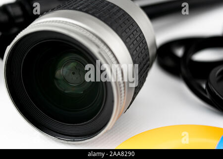 Close-up of shutter and lens of a photo camera lens, on white background Stock Photo
