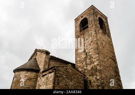 Old Valdibure, Pistoia, Tuscany, Italy parish church of Saint John San Giovanni a Montecuccoli, stone building with bell tower against white sky Stock Photo