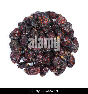Heap of dried rose hips isolated on white background Stock Photo