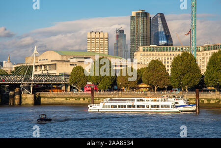 London, England, UK - September 12, 2019: Skyscrapers rise on the skyline behind the South Bank of the River Thames in central London. Stock Photo