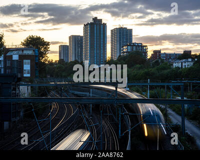 London, England, UK - September 5, 2019: The sun sets behind the high rise council housing tower blocks of the Chalcots Estate behind Camden Junction Stock Photo