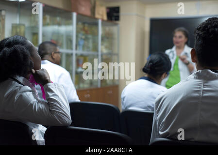 doctors, mixed race, in the classroom, at a medical conference. Young people, in white coats, with stethoscopes, are studying medicine. Classroom, ana Stock Photo