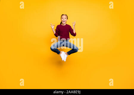 Full length body size view of her she nice attractive girlish cheerful cheery pre-teen girl jumping showing om sign zero gravity isolated on bright Stock Photo