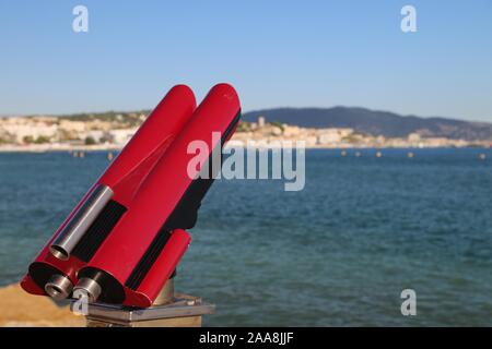 Red coin operated spotting scope Stock Photo