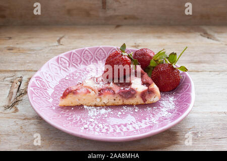 Round circle strawberry pie pasty cake tart cheesecake with fresh berries strawberries slice on plate dish retro vintage on solid wood country table. Stock Photo