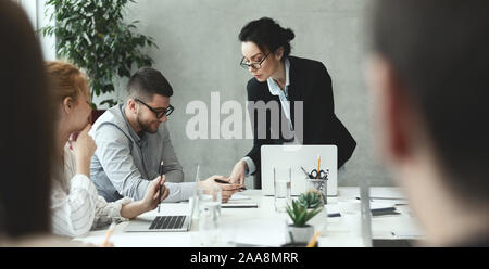 Creative people analyzing data on meeting in office Stock Photo