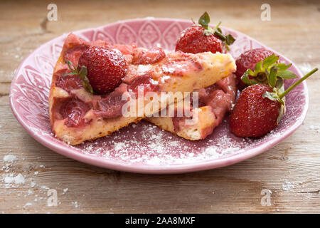 Round circle strawberry pie pasty cake tart cheesecake with fresh berries strawberries slice on plate dish retro vintage on solid wood country table. Stock Photo