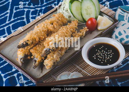 Deep fried and crispy shishamo fishes serve in Japanese style. Stock Photo