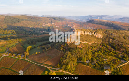France, Saone et Loire, Maconnais, Solutre Pouilly, the Roche de Solutre in autumn with the Roche de Vergisson in the background (aerial view) // Fran Stock Photo