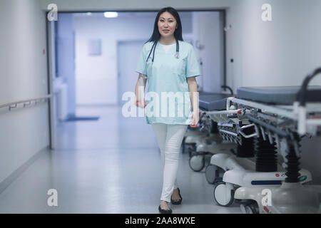 asia woman doctor walking in a hospital Stock Photo