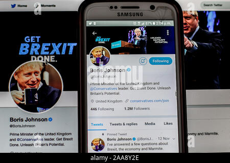 A screen-shot of British Prime Minister, Boris Johnson is seen on a mobile phone and a laptop. Stock Photo