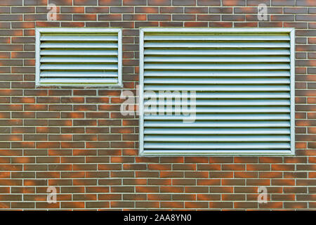 Two ventilation grilles on an estate building Stock Photo
