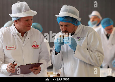 Outlander actor Scott Kyle (right) judging during the 2020 World Scotch Pie Championship at Carnegie Conference Centre, Dunfermline. Stock Photo