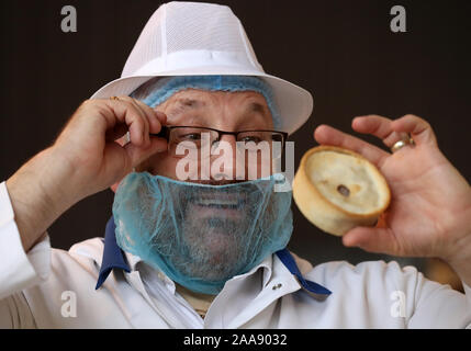 Jim McCormack holds a Scotch pie during judging at the 2020 World Scotch Pie Championship at Carnegie Conference Centre, Dunfermline. Stock Photo