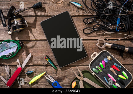 Flat lay of lure fishing tackle on a plain wooden background with copy  space Stock Photo - Alamy