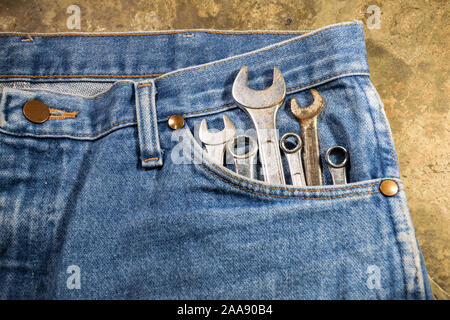 Tools in blue jeans pocket Stock Photo