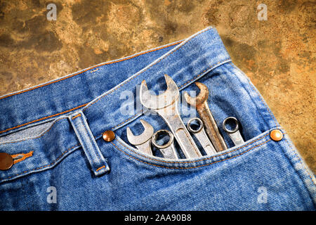 Tools in blue jeans pocket Stock Photo