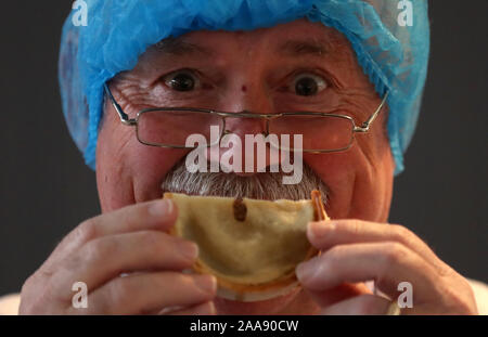 Judge David Kyles smells a Scotch pie during judging at the 2020 World Scotch Pie Championship at Carnegie Conference Centre, Dunfermline. PA Photo. Picture date: Wednesday November 20, 2019. Each company is permitted to enter one Scotch Pie, Sausage Roll, Bridie, Macaroni Pie, Apple Pie and up to five savoury products. Photo credit should read: Andrew Milligan/PA Wire Stock Photo