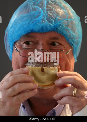 Judge David Kyles smells a Scotch pie during judging at the 2020 World Scotch Pie Championship at Carnegie Conference Centre, Dunfermline. PA Photo. Picture date: Wednesday November 20, 2019. Each company is permitted to enter one Scotch Pie, Sausage Roll, Bridie, Macaroni Pie, Apple Pie and up to five savoury products. Photo credit should read: Andrew Milligan/PA Wire Stock Photo