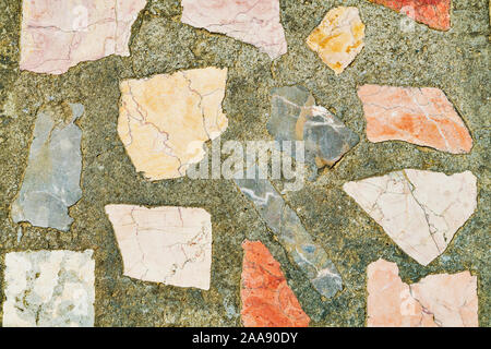a path with colorful stones in concrete Stock Photo