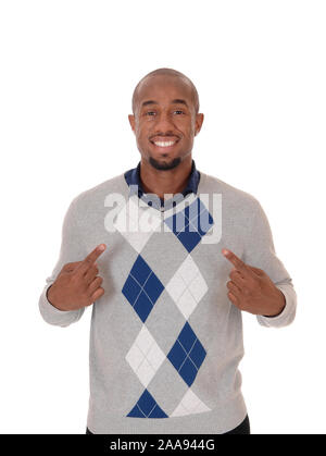 A handsome African American man standing in a sweater, smiling and pointing with his fingers at himself, isolated for white background Stock Photo