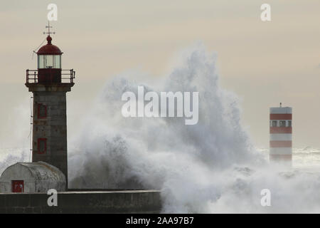Big breaking sea waves over Douro river mouth piers and lighthouses Stock Photo
