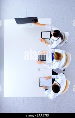 Flat lay, top view. Group of doctors with tablets and computers at hospital discussion and show something on the screen-medicine, healthcare and cardi Stock Photo