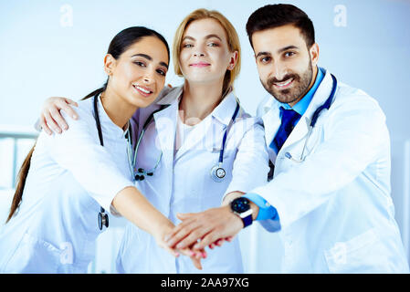 Multiracial medical team stacking hands Stock Photo