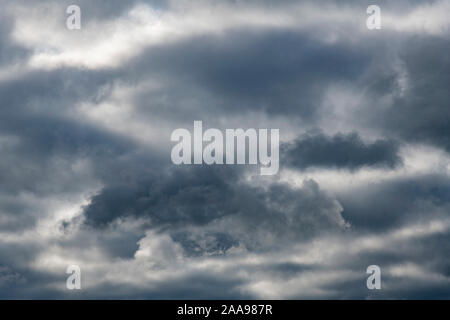 Dark and brooding sky. For bad times ahead, gathering storm clouds, Every Cloud has Silver Lining, abstract sky, economic storm clouds, gloomy outlook Stock Photo