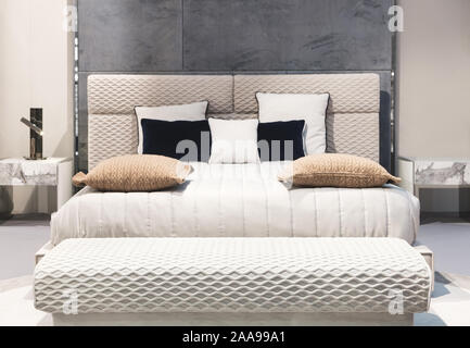 classic interior design bedroom beige gray and blue, Interior of a bedroom with cushions Stock Photo