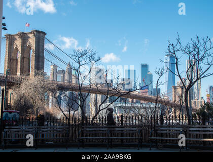 Brooklyn Bridge and Cityscape of New York skyline seen from riverside in Dumbo. Stock Photo