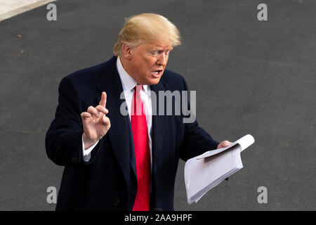 United States President Donald J. Trump speaks to the media on the South Lawn of the White House in Washington, DC, U.S., on Wednesday, November 20, 2019, as he departs for a day trip to Austin, Texas. Credit: Stefani Reynolds/CNP /MediaPunch Stock Photo