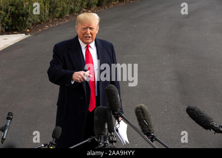 United States President Donald J. Trump speaks to the media on the South Lawn of the White House in Washington, DC, U.S., on Wednesday, November 20, 2019, as he departs for a day trip to Austin, Texas. Credit: Stefani Reynolds/CNP /MediaPunch Stock Photo