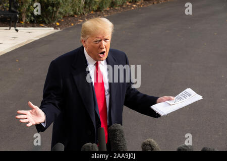 United States President Donald J. Trump speaks to the media on the South Lawn of the White House in Washington, DC, U.S., on Wednesday, November 20, 2019, as he departs for a day trip to Austin, Texas. Credit: Stefani Reynolds/CNP /MediaPunch Stock Photo