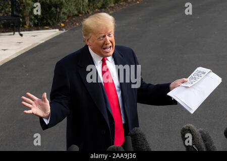 United States President Donald J. Trump speaks to the media on the South Lawn of the White House in Washington, DC, U.S., on Wednesday, November 20, 2019, as he departs for a day trip to Austin, Texas. Credit: Stefani Reynolds/CNP /MediaPunch Stock Photo