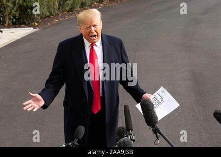 United States President Donald J. Trump speaks to the media on the South Lawn of the White House in Washington, DC, U.S., on Wednesday, November 20, 2019, as he departs for a day trip to Austin, Texas. Credit: Stefani Reynolds/CNP /MediaPunch Stock Photo