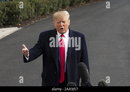 Washington, District of Columbia, USA. 20th Nov, 2019. United States President Donald J. Trump speaks to the media on the South Lawn of the White House in Washington, DC, U.S., on Wednesday, November 20, 2019, as he departs for a day trip to Austin, Texas. Credit: Stefani Reynolds/CNP/ZUMA Wire/Alamy Live News Stock Photo