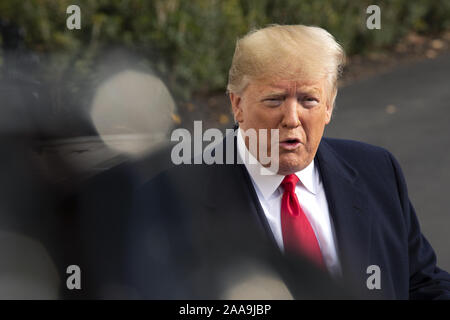 Washington, District of Columbia, USA. 20th Nov, 2019. United States President Donald J. Trump speaks to the media on the South Lawn of the White House in Washington, DC, U.S., on Wednesday, November 20, 2019, as he departs for a day trip to Austin, Texas. Credit: Stefani Reynolds/CNP/ZUMA Wire/Alamy Live News Stock Photo