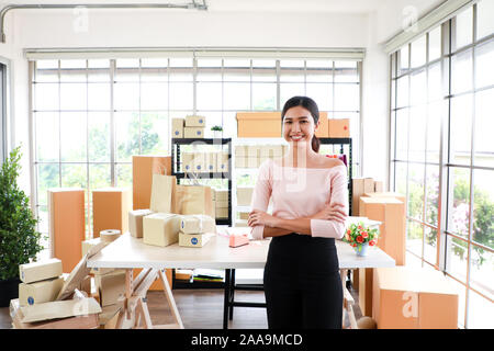 Woman with success the exporting business or online sales in concept of sme,e - commerce business. Stock Photo