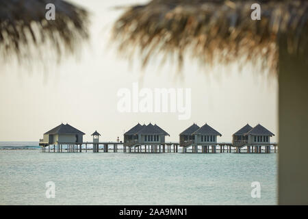 Water bungalows in hotel on Maldives. Villas on Indian ocean at luxury spa resort. Stock Photo