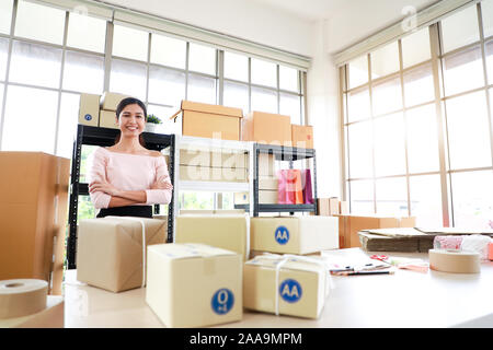 Woman with success the exporting business or online sales in concept of sme,e - commerce business. Stock Photo