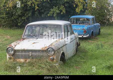 two old cars abandoned in the yard Stock Photo