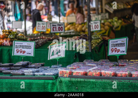 A temporary public market in England, normally set up outdoors on certain days of the week, often, but not always, in a street Stock Photo