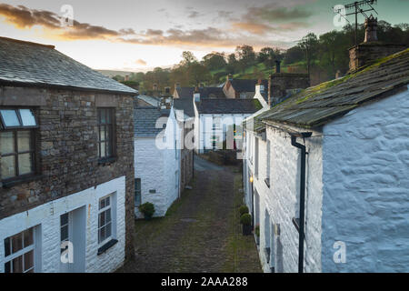 The picturesque cobbled streets in the village of Dent, in Dentdale, Cumbria. Stock Photo